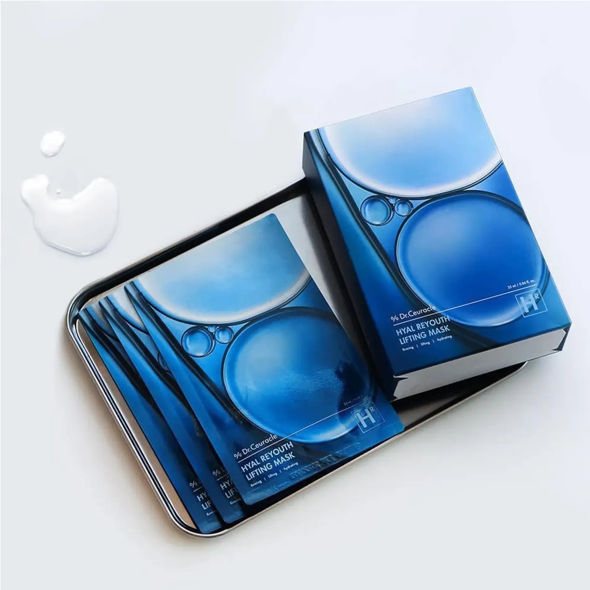 DR.CEURACLE Hyal Reuse Lifting Mask (10EA) packaging on a tray with liquid drops