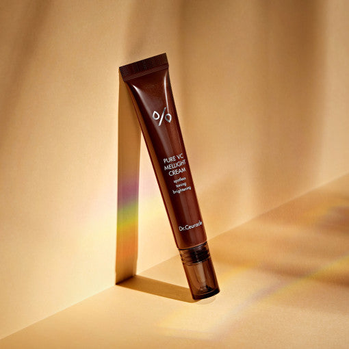 DR.CEURACLE Pure VC Melight Cream 20ml on a golden background, highlighting luxurious skincare packaging and design.