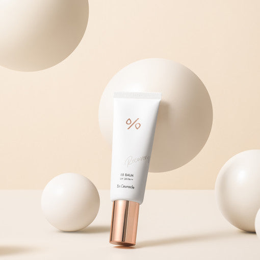 DR.CEURACLE Recovery BB Balm SPF 28 PA++ 45ml on display with abstract beige background