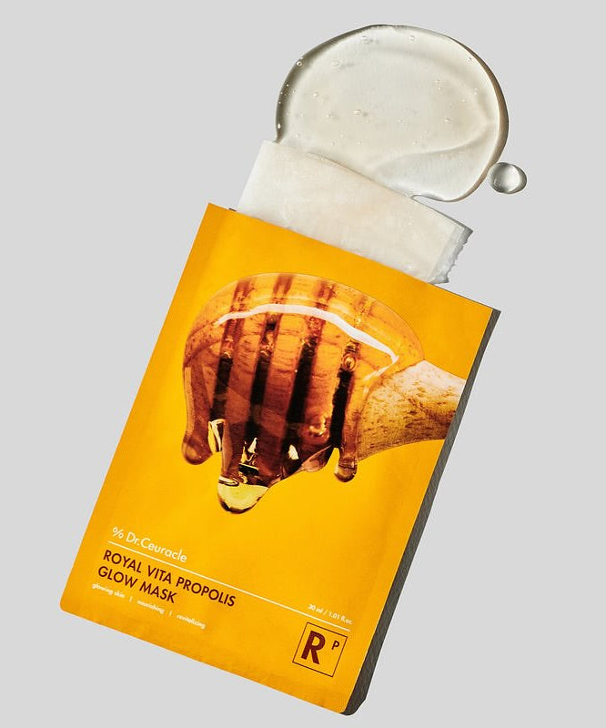 DR.CEURACLE Royal Vita Propolis Glow Mask (10EA) image showing the packaging and mask essence on a gray background.