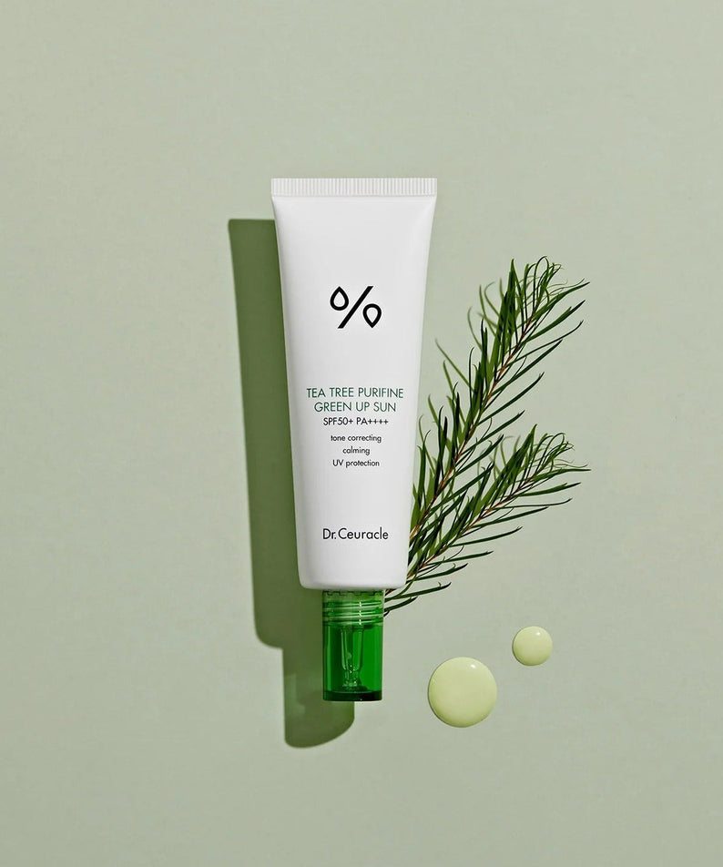 DR.CEURACLE Tea Tree Purifine Green Sup Sun 50ml with greenery backdrop