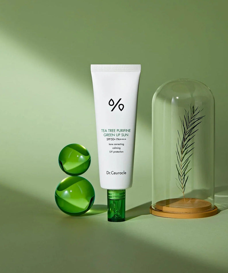 DR.CEURACLE Tea Tree Purifine Green Sup Sun 50ml with SPF 50, photographed with green accents and botanical decoration.