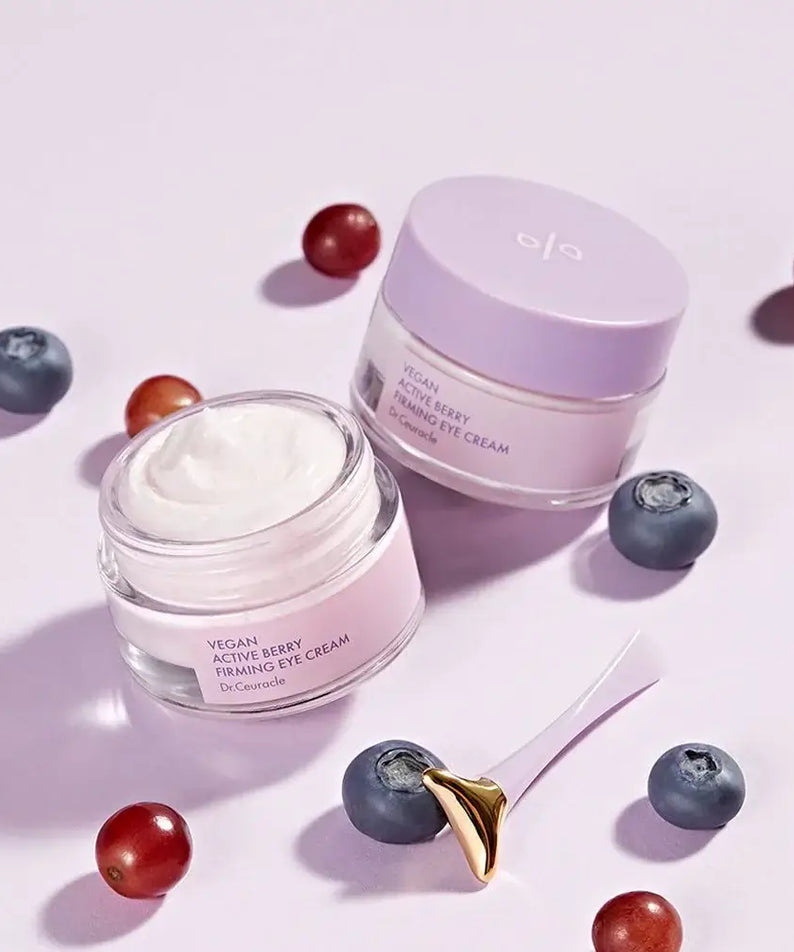 DR.CEURACLE Vegan Active Berry Firming Eye Cream with open jar and berries, featuring anti-aging skincare formula.