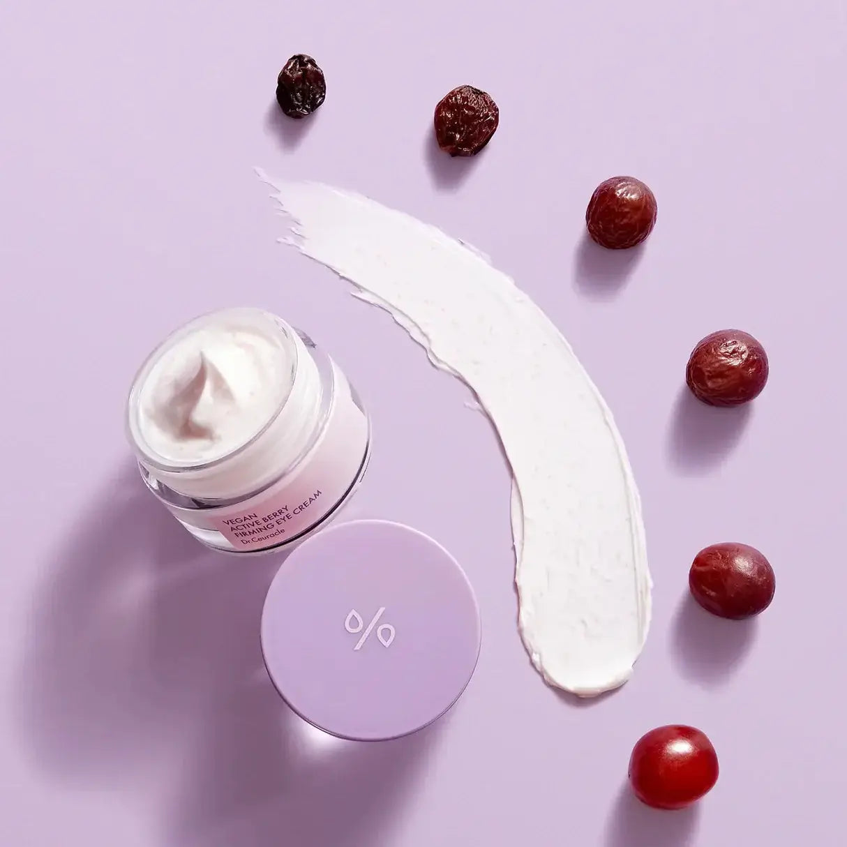 DR.CEURACLE Vegan Active Berry Firming Eye Cream with berries on purple background