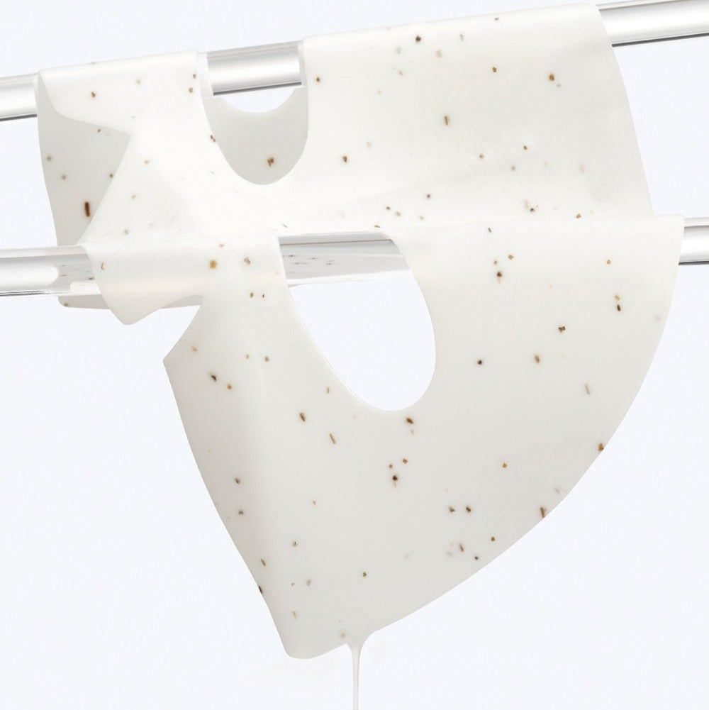 Close-up of DR.G Red Blemish Hyal Cica Cooling Gel Mask 1 Sheets on a drying rack, showcasing its texture and cooling properties.