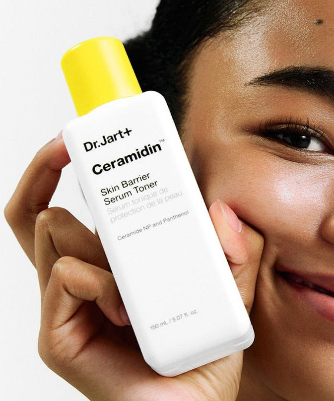 DR.JART+ Ceramidin Skin Barrier Serum Toner 150ml held by smiling man for Gentleman Korea, hydrating ceramide toner for dry skin