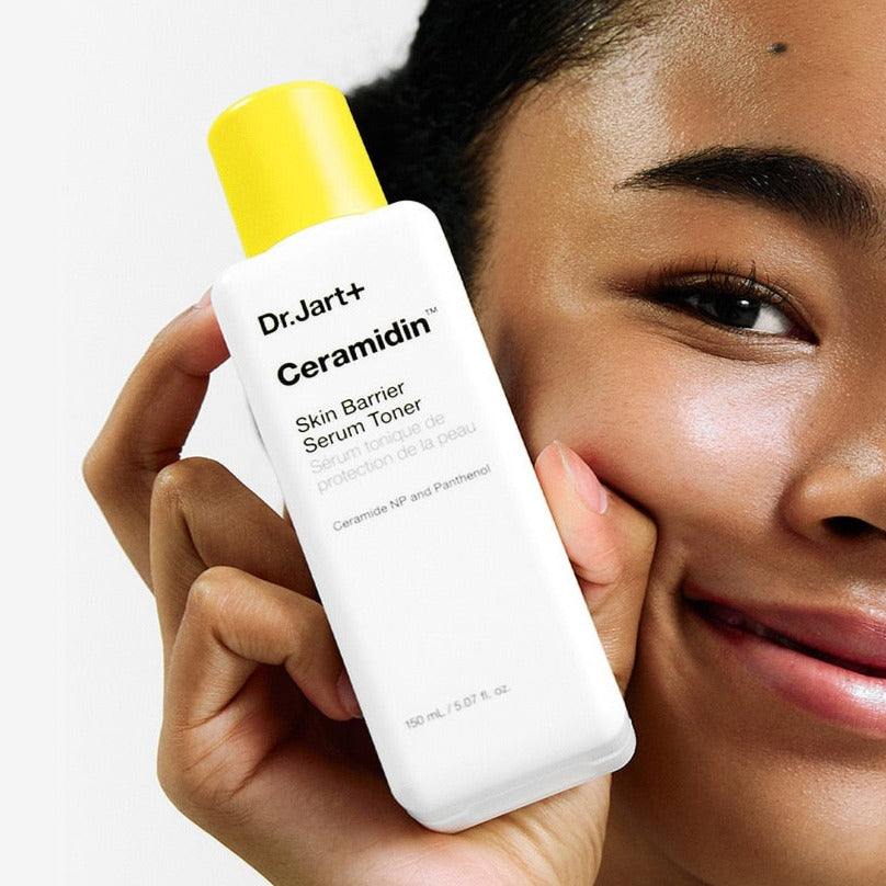 DR.JART+ Ceramidin Skin Barrier Serum Toner 150ml held by smiling man for Gentleman Korea, hydrating ceramide toner for dry skin