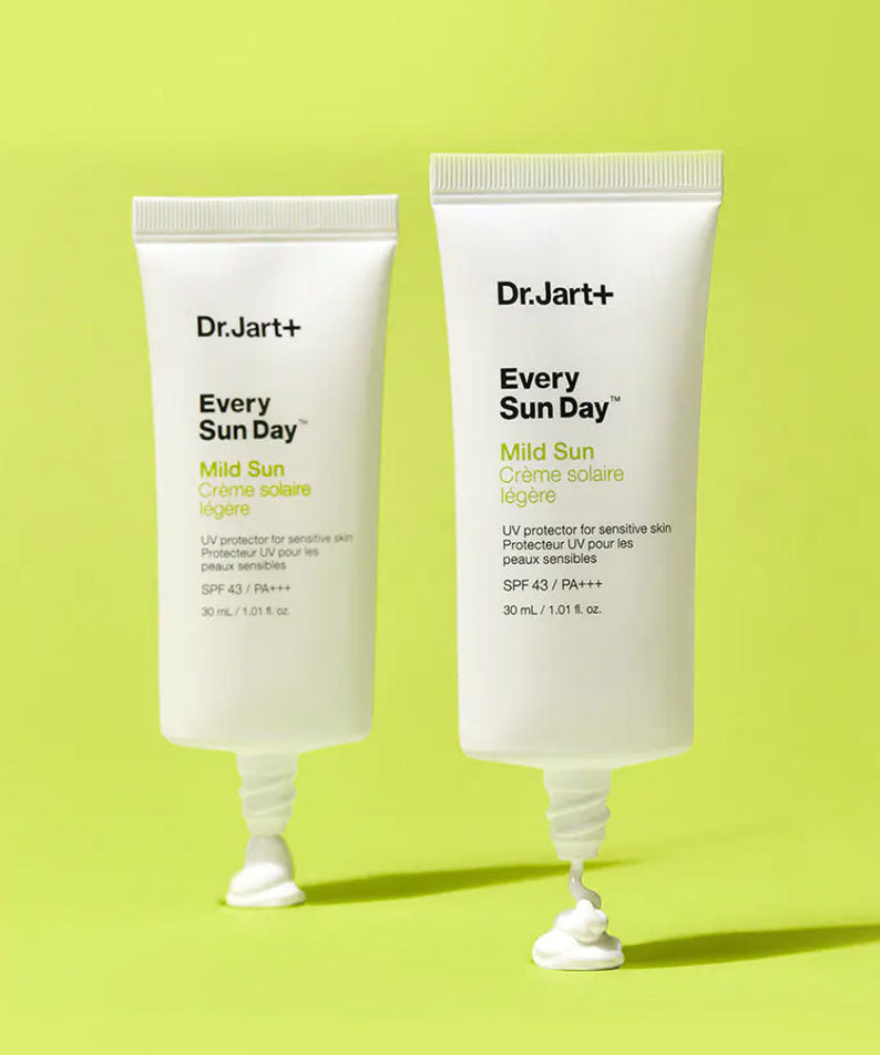 Two tubes of DR.JART+ Every Sun Day Mild Sun 30ml on a green background, showcasing their mild sun protection formula.
