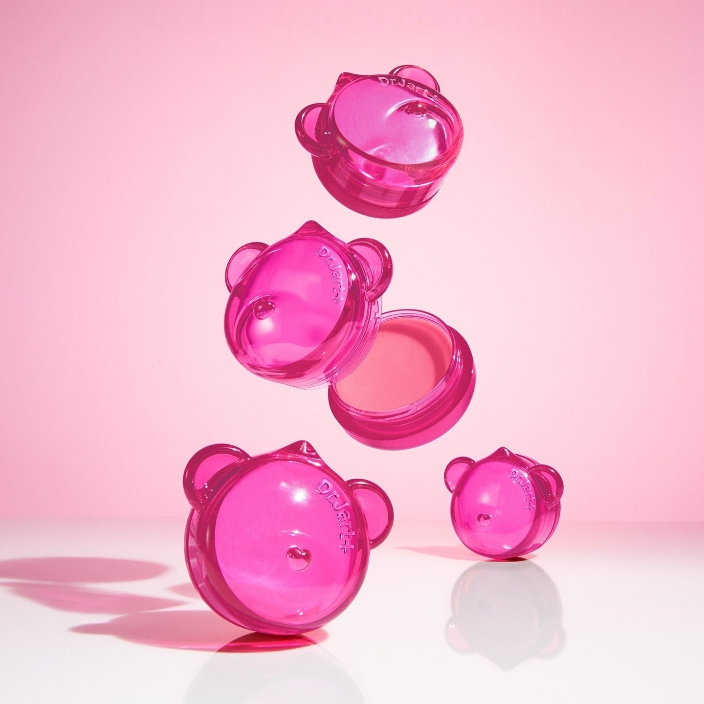 DR.JART+ Vital Hydra Solutionâ„¢ Hydrating Lip Mask in playful pink containers against a pink background