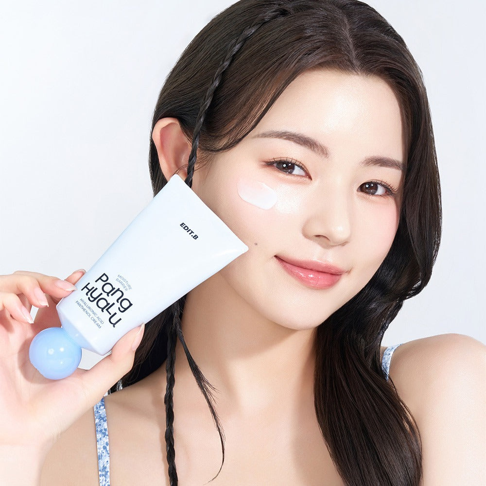Woman holding EDIT.B Moisture Barrier Pang Hyaluronic Acid Pathenol Cream 100ml with smile.