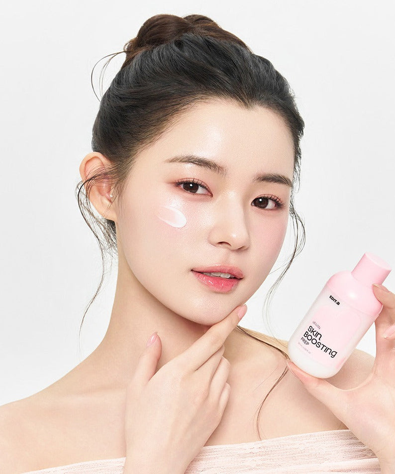 EDIT.B Veil On Skin Boosthing Prep 50ml held by model, showcasing application on cheek.