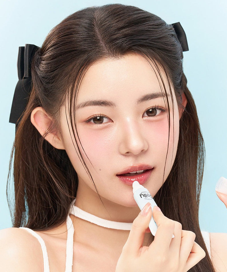 Model applying EDIT.B Waterful Jelly Lip Essence 11ml, showcasing glossy lip effect.