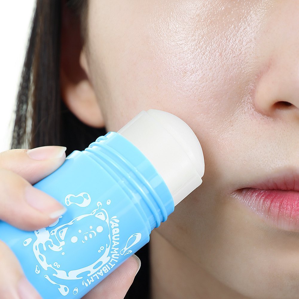 Woman applying ELIZAVECCA Aqua Multii Balm 30g to her face for moisturizing care.