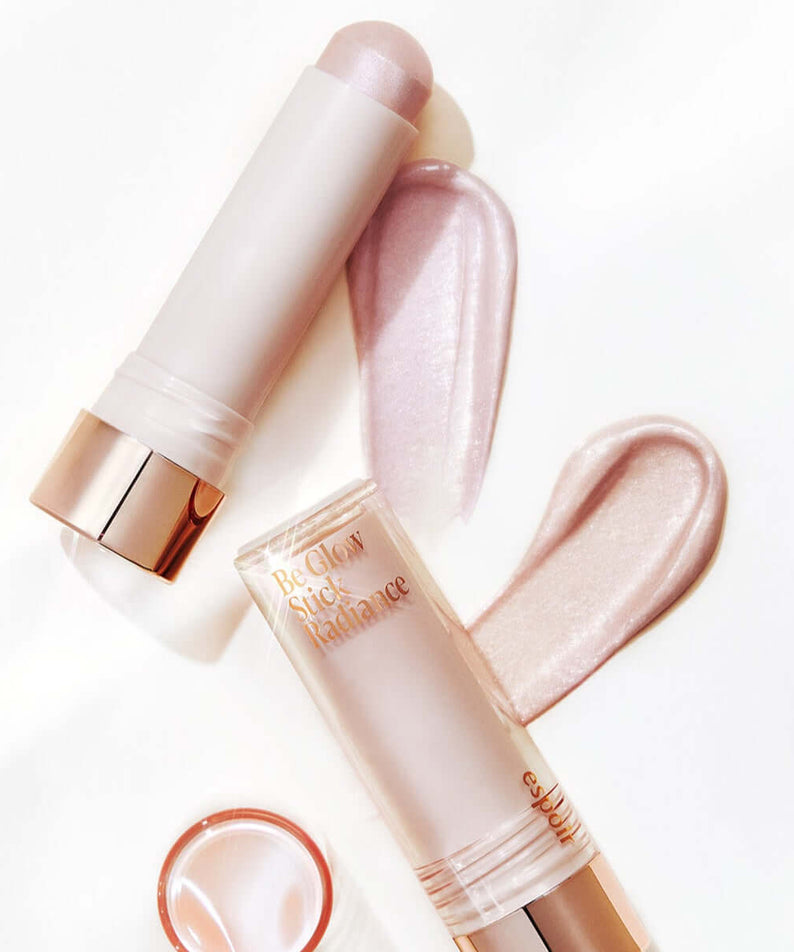 ESPOIR BE GLOW STICK RADIANCE highlighting makeup product on white background with swatches of shimmer.