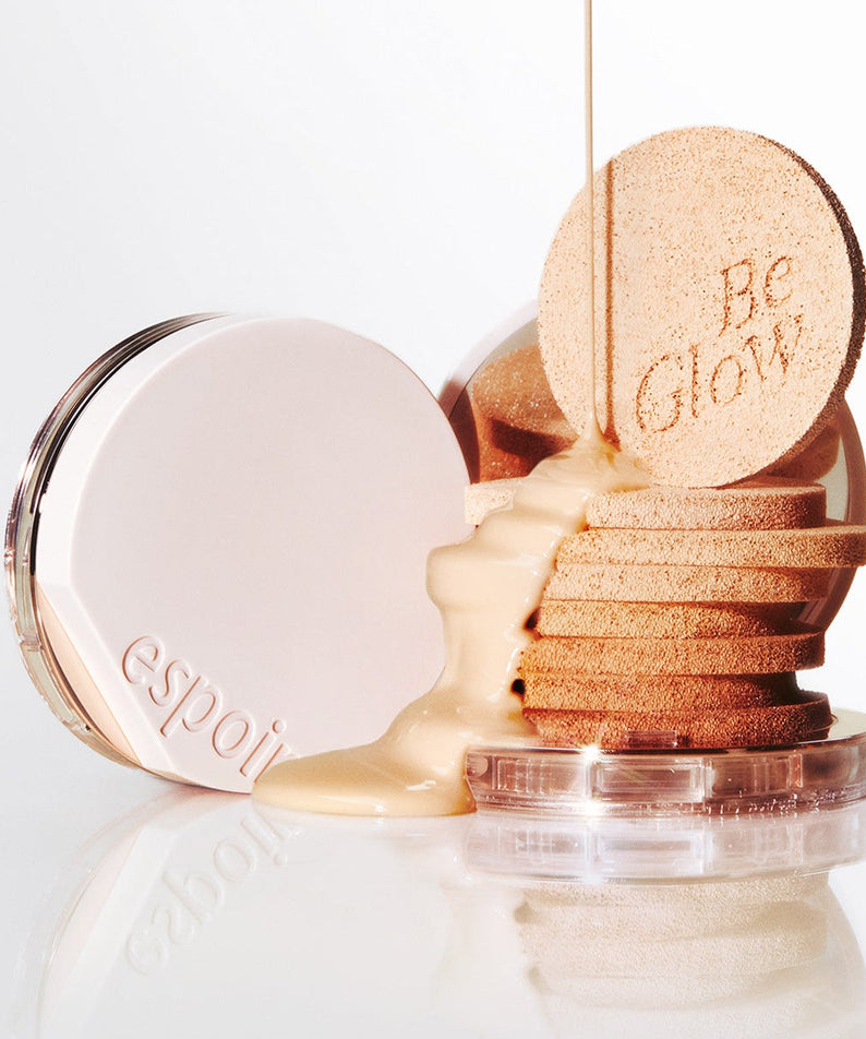 ESPOIR BE GLOW VOLUME CUSHION SPF42 PA+++ product with foundation and applicators displayed stylishly.