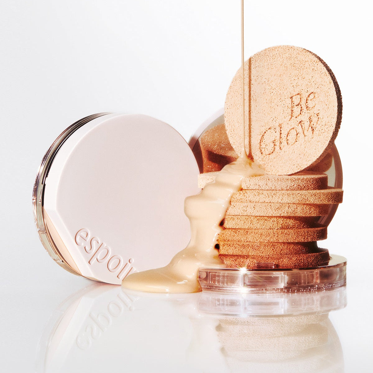 ESPOIR BE GLOW VOLUME CUSHION SPF42 PA+++ product with foundation and applicators displayed stylishly.