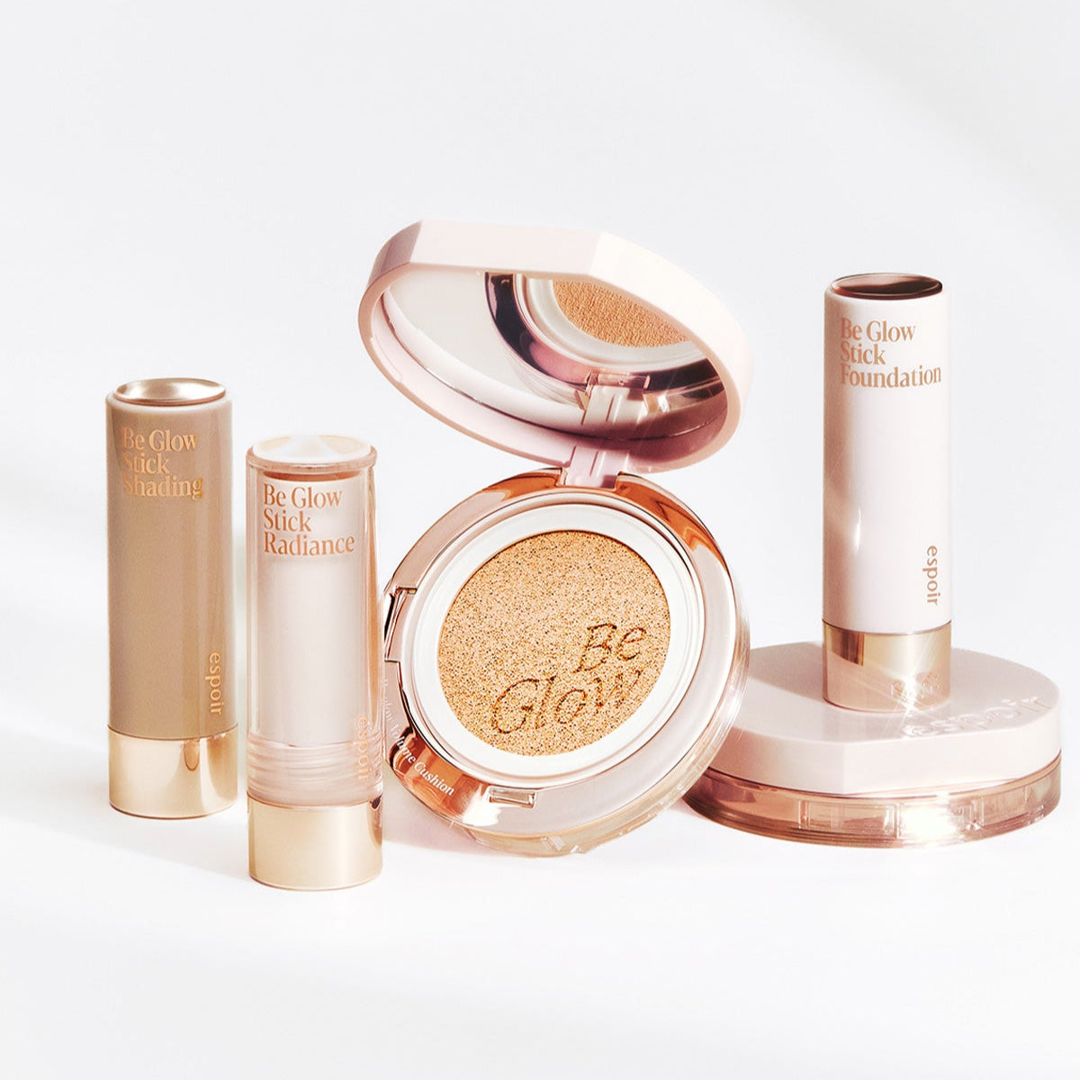 ESPOIR BE GLOW VOLUME CUSHION SPF42 PA+++ with Be Glow Stick Foundation products in a stylish arrangement.