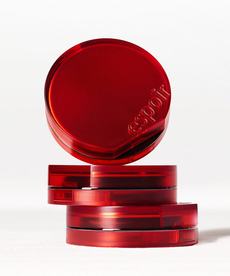 ESPOIR BE VELVET COVER CUSHION SPF42 PA++ in elegant red packaging with embossed branding, stacked for a stylish look.