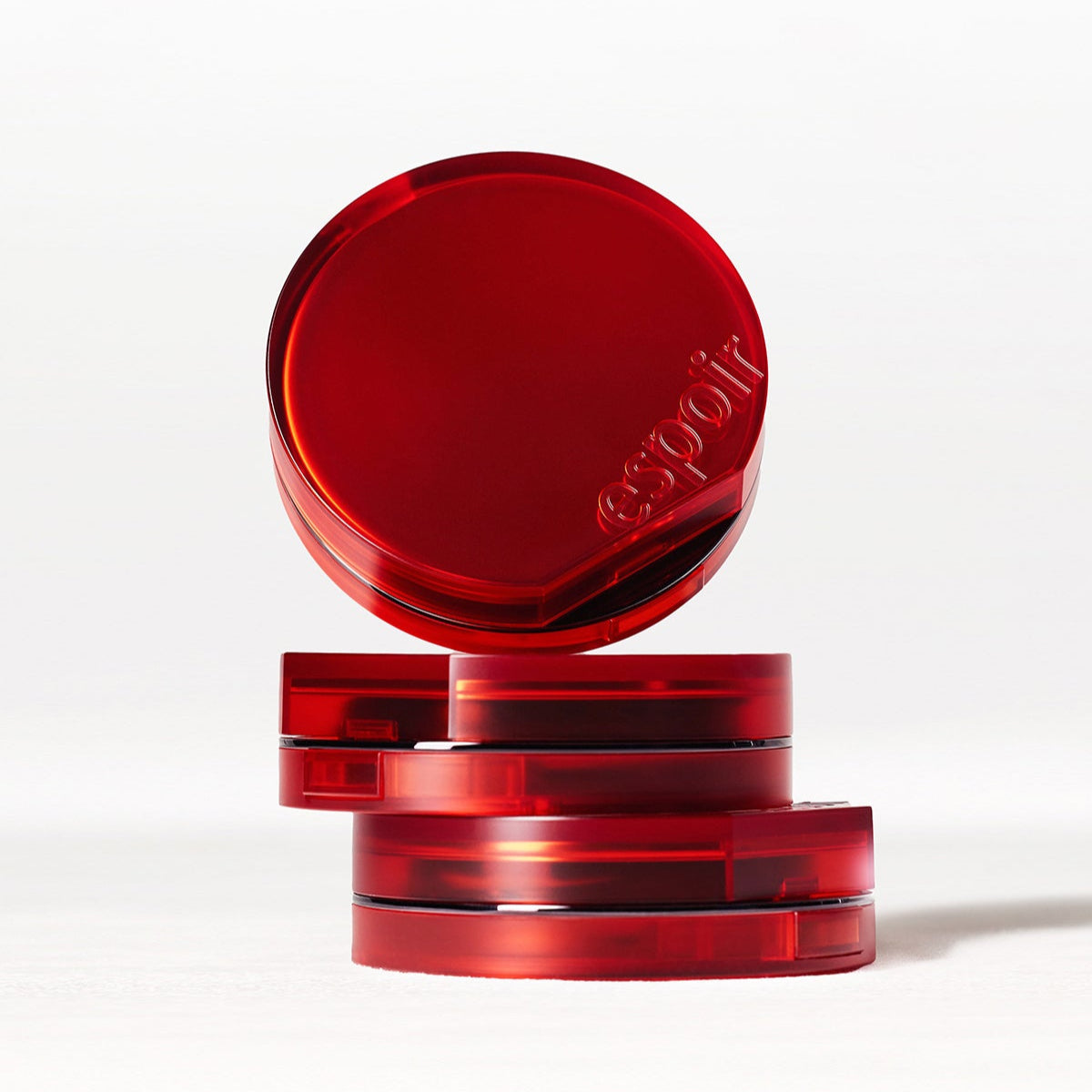 ESPOIR BE VELVET COVER CUSHION SPF42 PA++ in elegant red packaging with embossed branding, stacked for a stylish look.