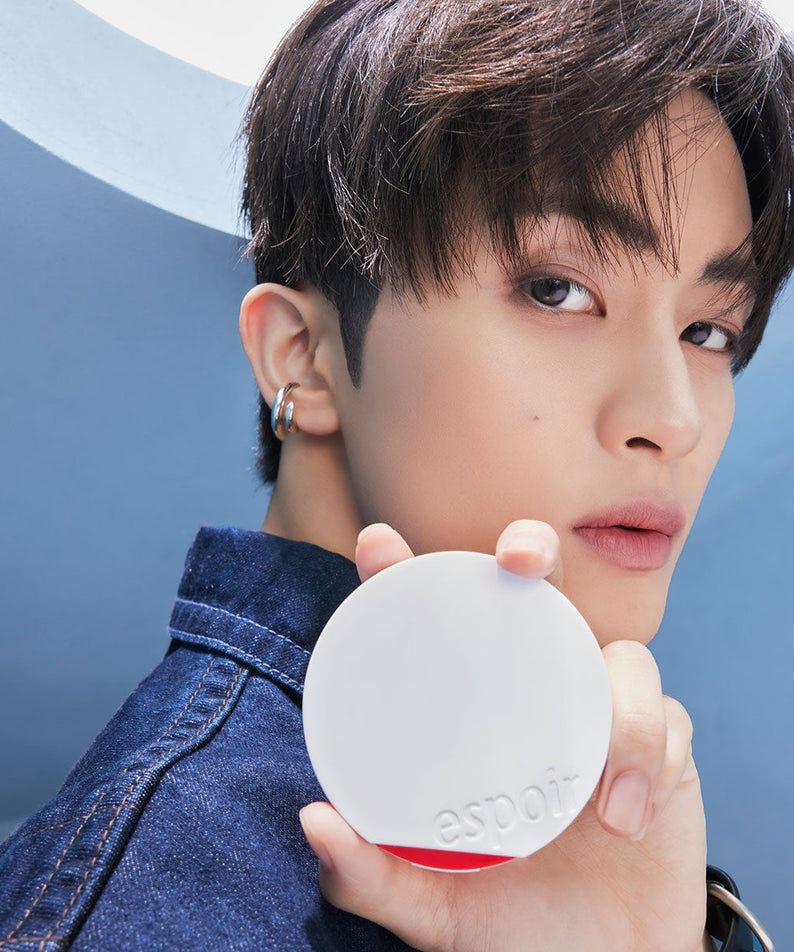 Model holding ESPOIR Bevelvet Sebumcut Cooling Cushion in sleek compact design, showcasing skincare product benefits.