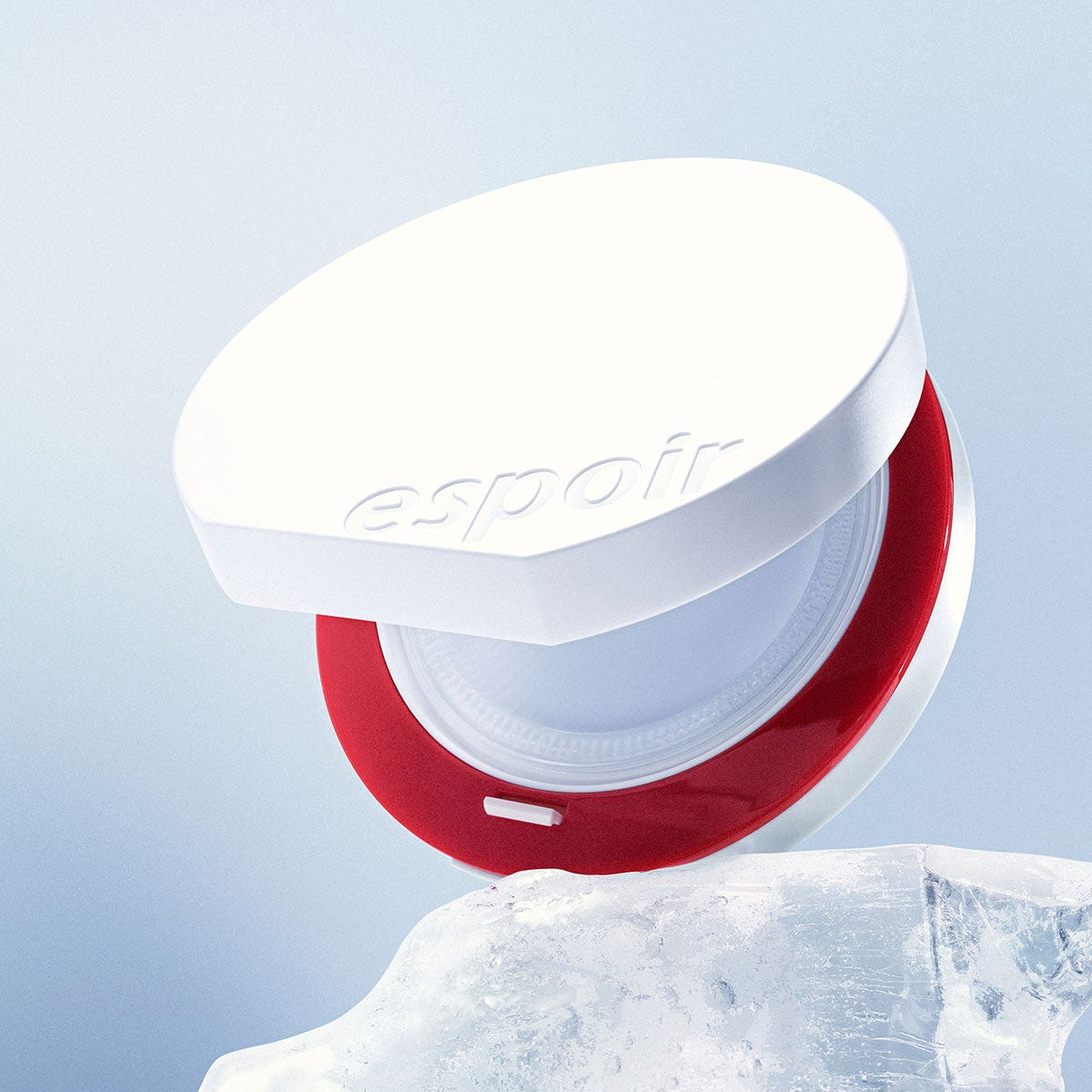 ESPOIR Bevelvet Sebumcut Cooling Cushion on ice, showcasing its sleek design and cooling properties.
