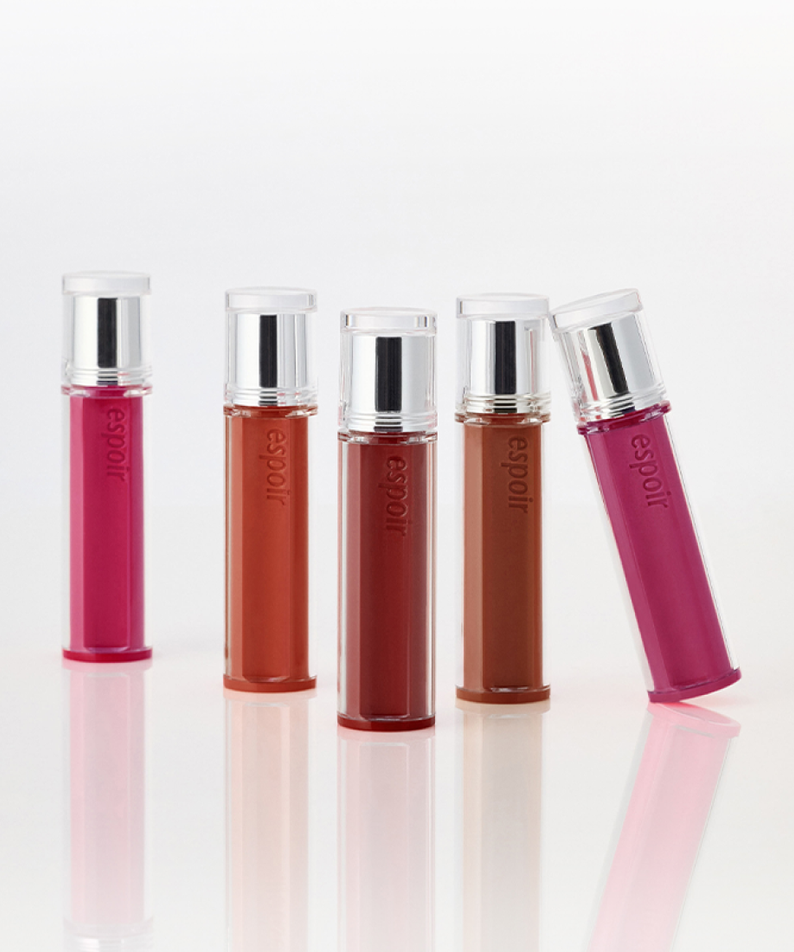 ESPOIR Couture Lip Tint Glaze [NEW COLOR] collection showcasing five vibrant shades in sleek bottles.