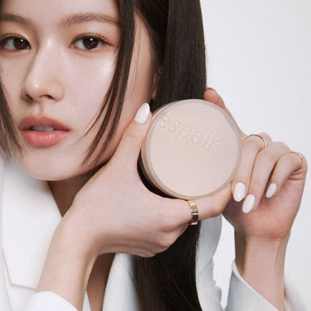 Woman holding ESPOIR Protailor Be Natural Cushion SPF50 PA++++ compact