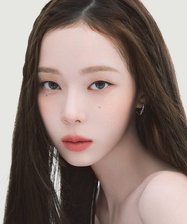 Close-up portrait showcasing precise eyebrow definition using ESPOIR THE BROW EASY SHAPING PENCIL, highlighting natural beauty.