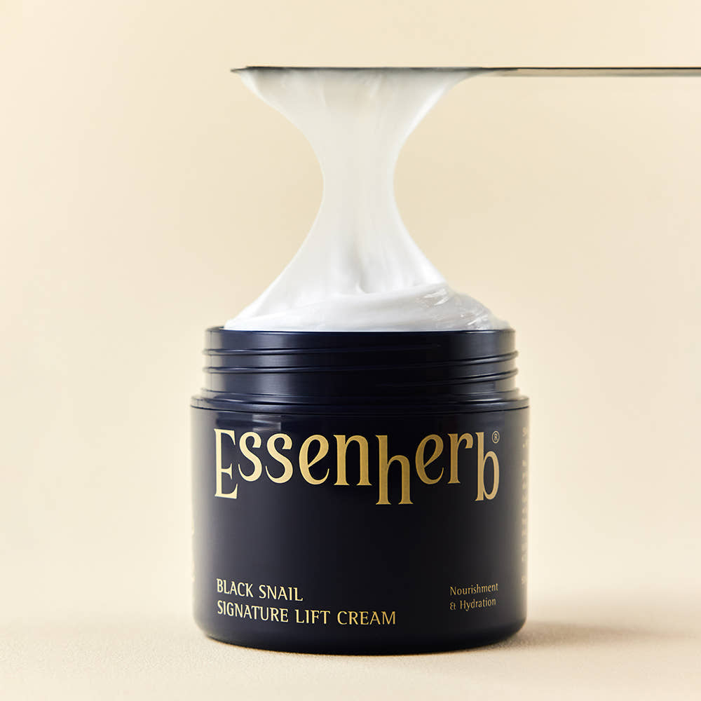 ESSENHERB Black Snail Signature Lift Cream 50ml jar with cream being applied, showcasing texture and packaging.