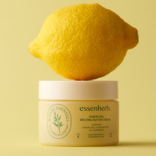 ESSENHERB Lemon Dill Melting Buttercream 55ml with fresh lemon on top of the jar, natural skincare product image