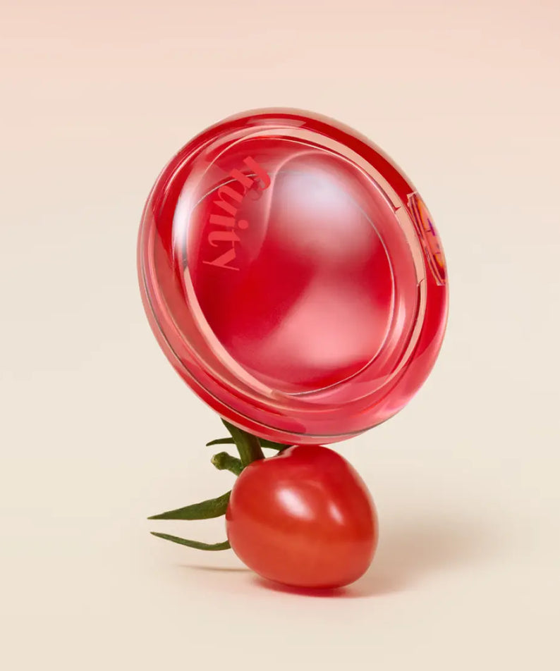 ETUDE Fruity Lip & Cheek Blur Balm 2.3g displayed with a cherry tomato, showcasing its vibrant, fruity aesthetic.