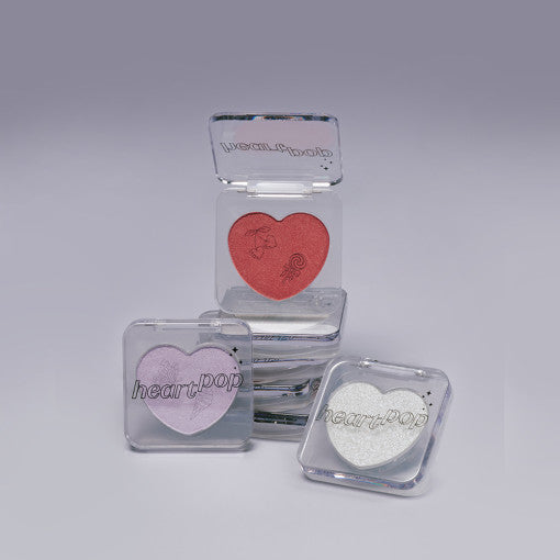 Three shades of ETUDE Heart Pop Blush #NotBadCollection showcasing vibrant colors in clear heart-shaped packaging.