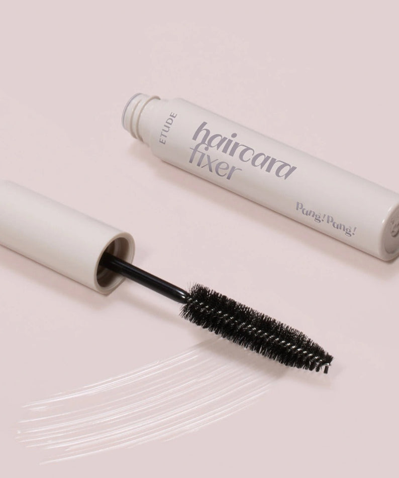 ETUDE Pangpang Hair Cara Fixer 10ml on a light background with an open brush applicator and product strokes.
