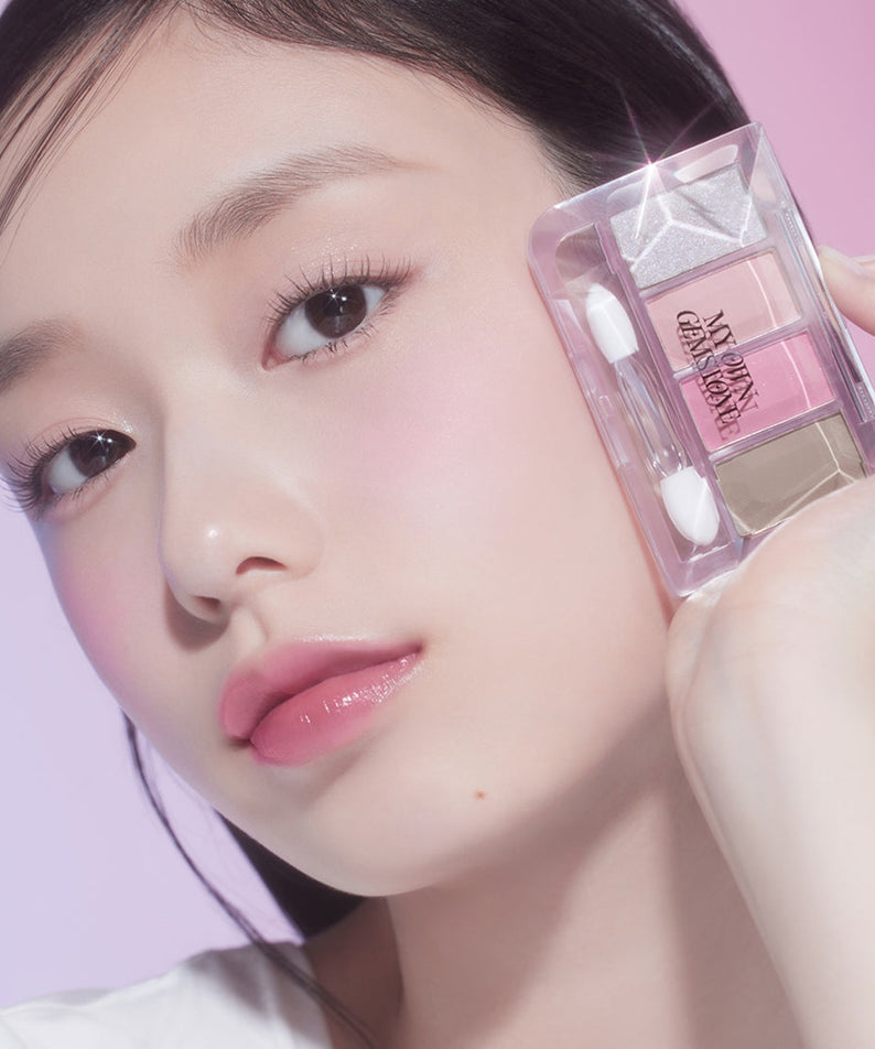 Model holding ETUDE Play Color Eyes Mini [Jamstone New Year Collection] with pink and neutral shades, promoting vibrant eye makeup looks.
