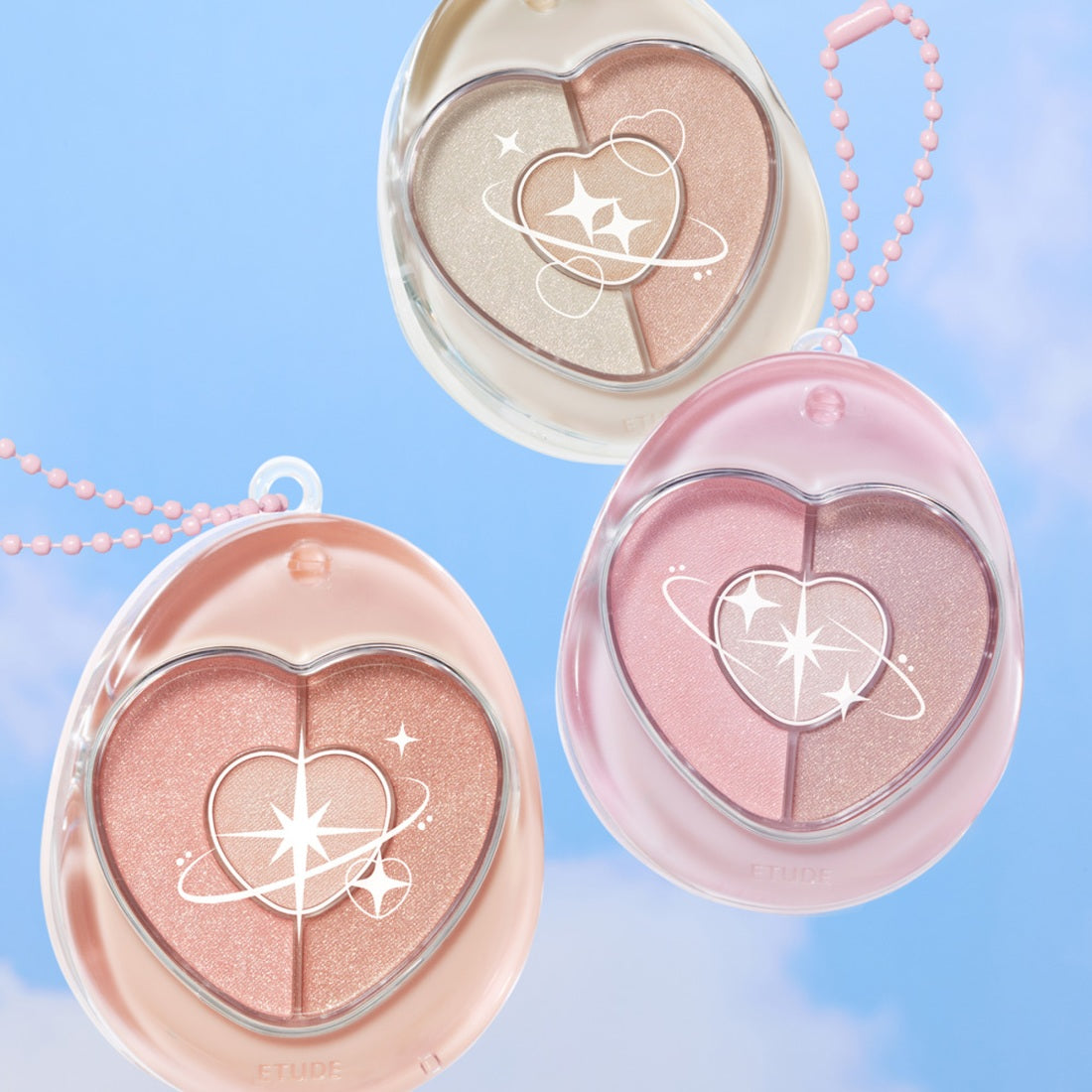 ETUDE Poyong Eye Maker eye shadow compacts in pastel colors against a blue sky background