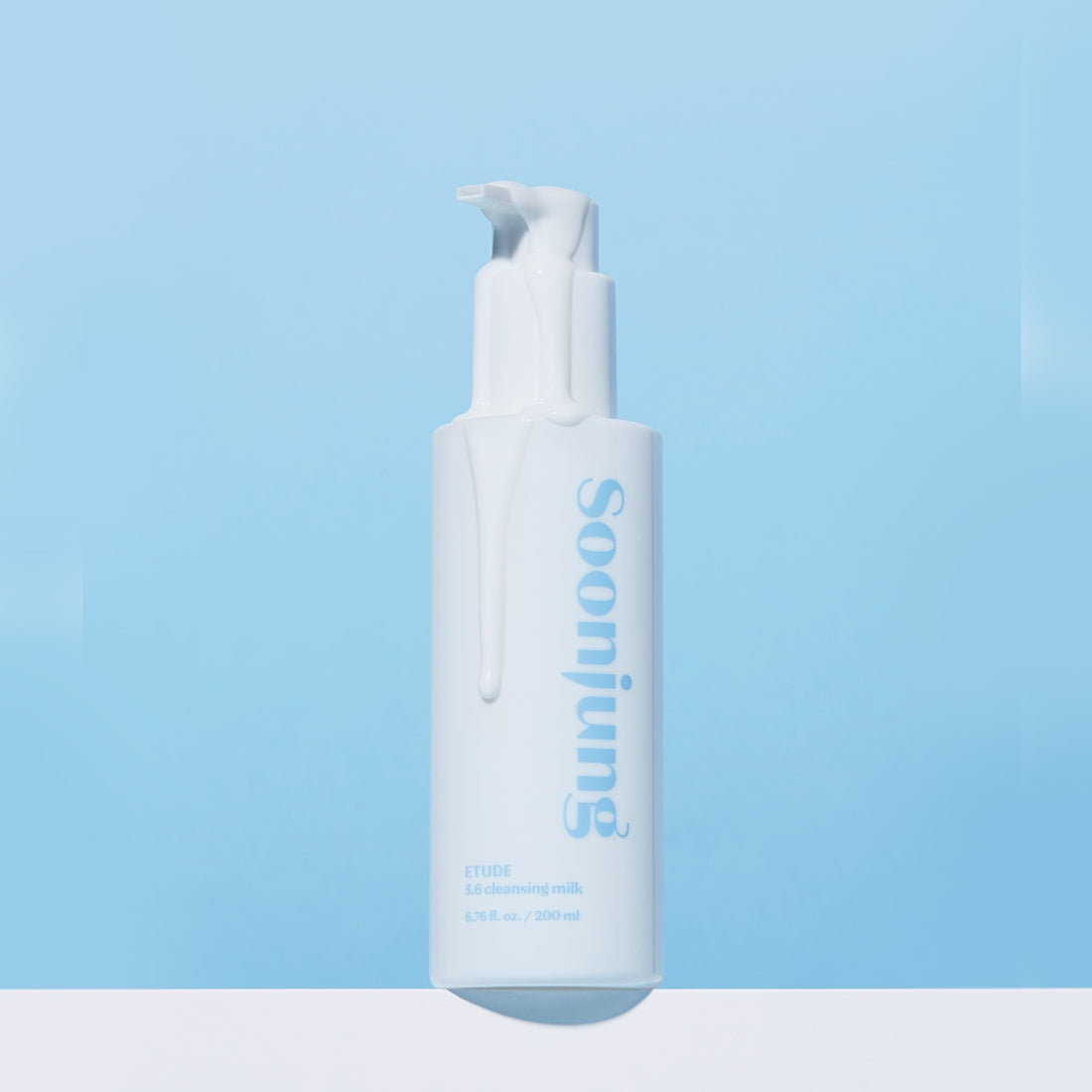 ETUDE Pure Mildly Acidic Cleansing Milk 200ml in white and blue bottle on blue background