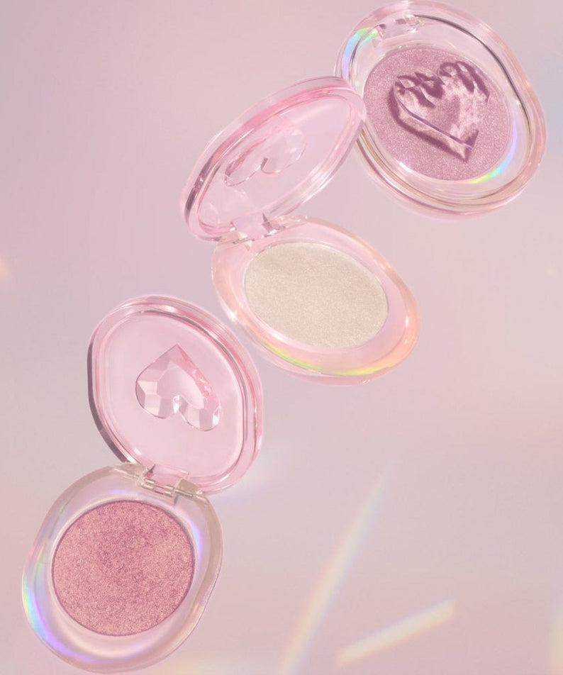 ETUDE Shooting Beam Highlighter 3g in open cases showcasing shimmer shades