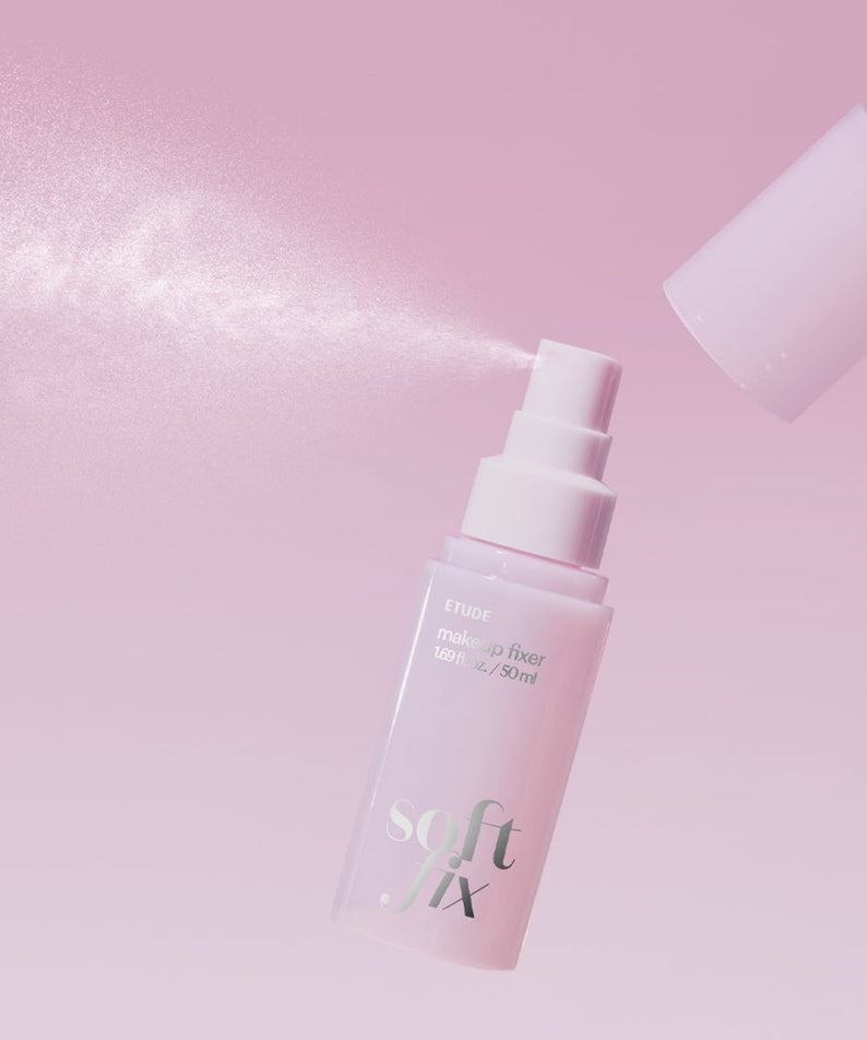 ETUDE Soft Fix Makeup Fixer 50ml spray in action against a soft pink background.