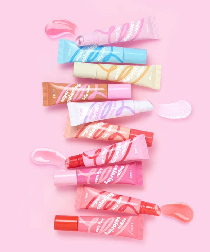 Assorted colors of ETUDE Sugar Coloring Jelly Balm 9g tubes on pink background