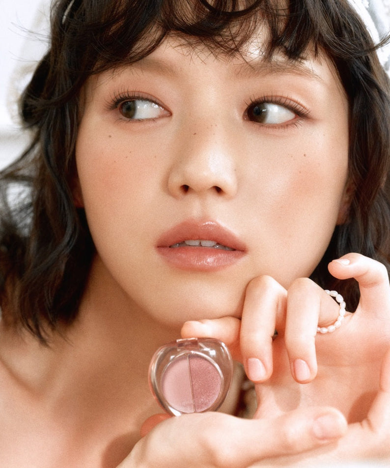 ETUDE What's in My Eyes Cafe Double eyeshadow held by a model showcasing natural makeup look