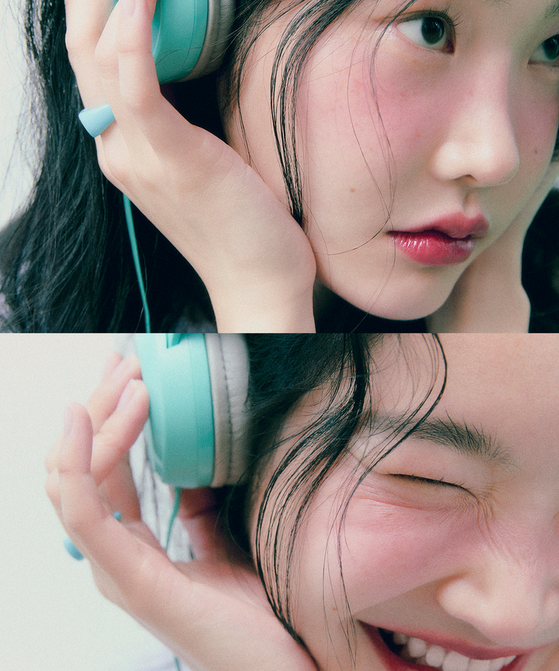 Person wearing headphones showing vibrant cheeks, possibly using FEEV Hyper-Fit Color Serum Mini Blush.