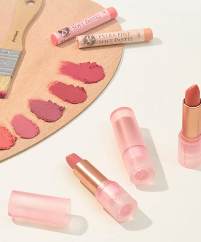 FORENCOS All Light Mood Chiffon Lipstick in soft shades with a brush and color swatches on a wooden palette.