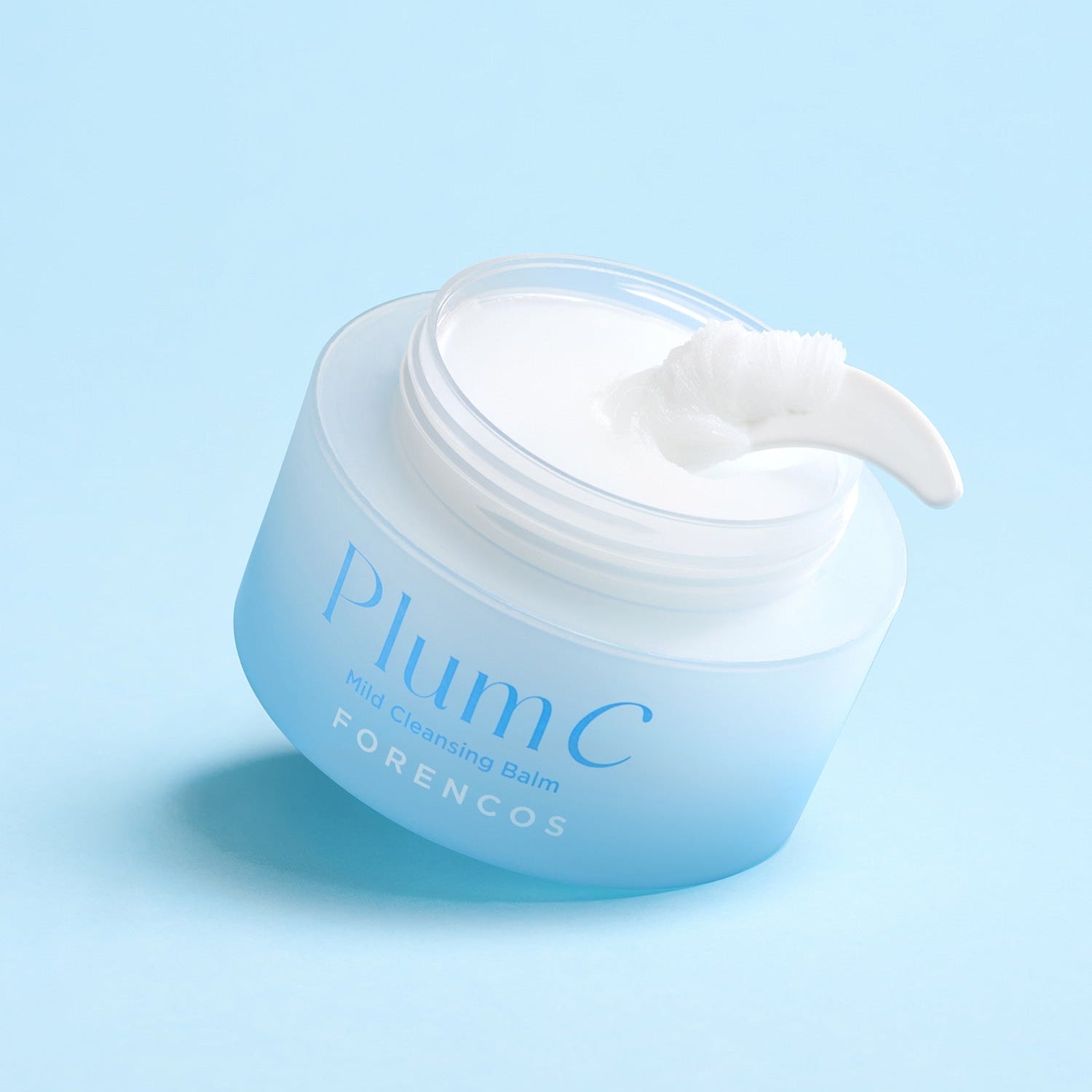 FORENCOS Plum C Mild Cleansing Balm 50ml in open jar with spatula on blue background
