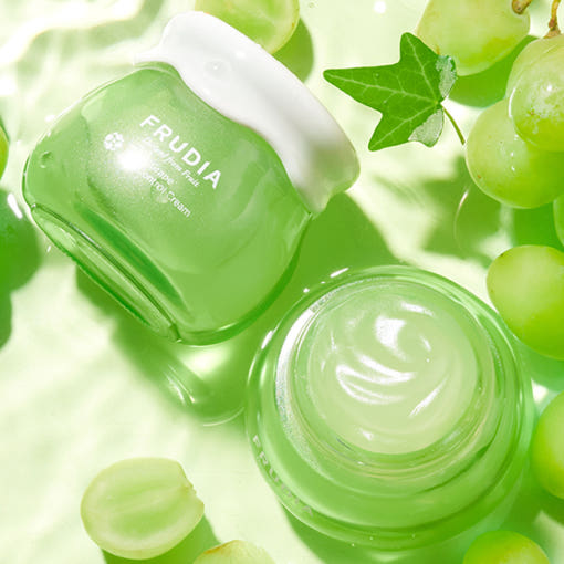FRUDIA Green Grape Pore Control Vegan Cream 55ml in open and closed containers with grapes background
