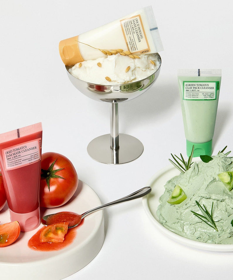 FULLY Fully Pack Cleanser 3-piece set including red, green, and white cleanser tubes next to fresh ingredients on display.