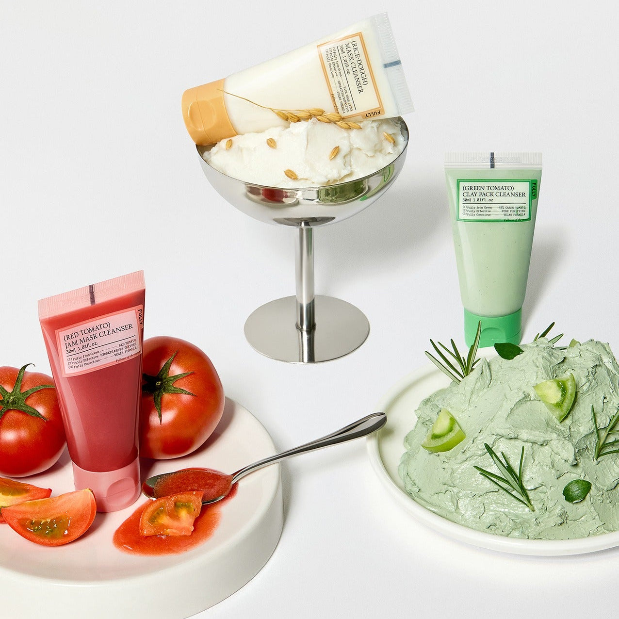 FULLY Fully Pack Cleanser 3-piece set including red, green, and white cleanser tubes next to fresh ingredients on display.