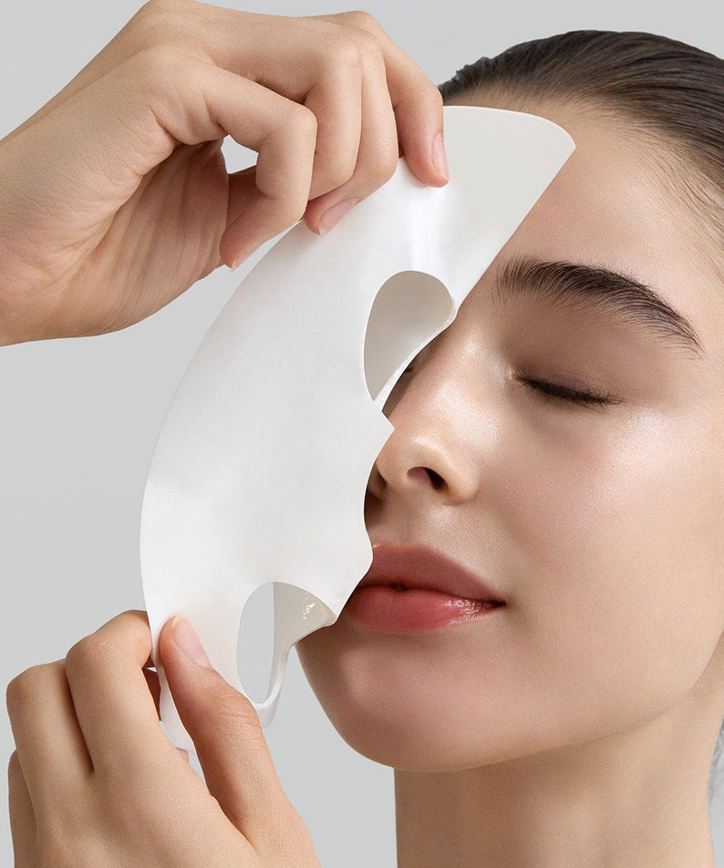 Person applying FULLY Rice dough modeling mask 4ea to face, showcasing skincare benefits and texture.