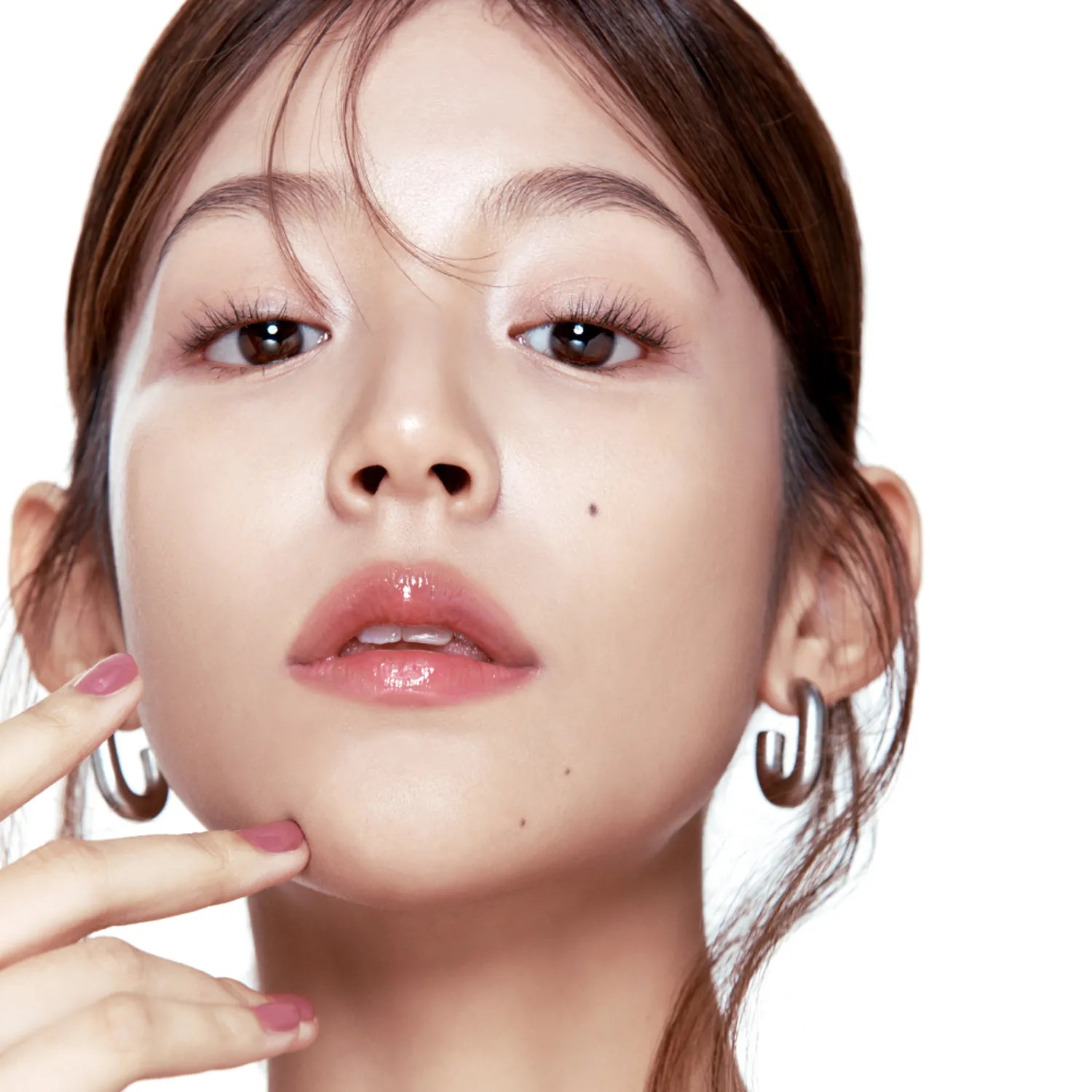 Woman wearing FWEE 3D Voluming Gloss for enhanced lip volume and shine