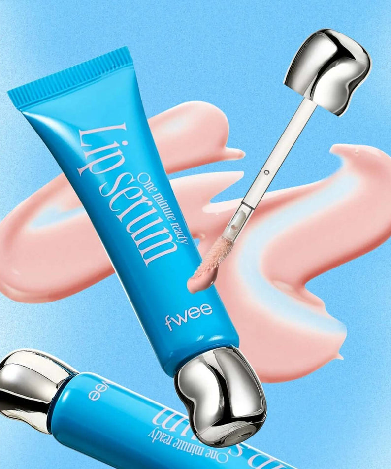 FWEE One Minute Ready Lip Serum tube with applicator on blue background, featuring pink serum texture.
