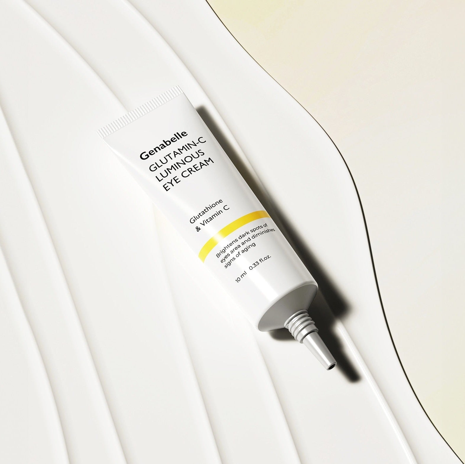 GENABELLE Glutamin-C Luminous Eye Cream 10ml tube on abstract background